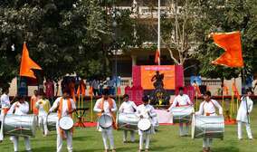 Students playing dhol at the Maharashtra Day celebration at MIT World Peace School Alandi