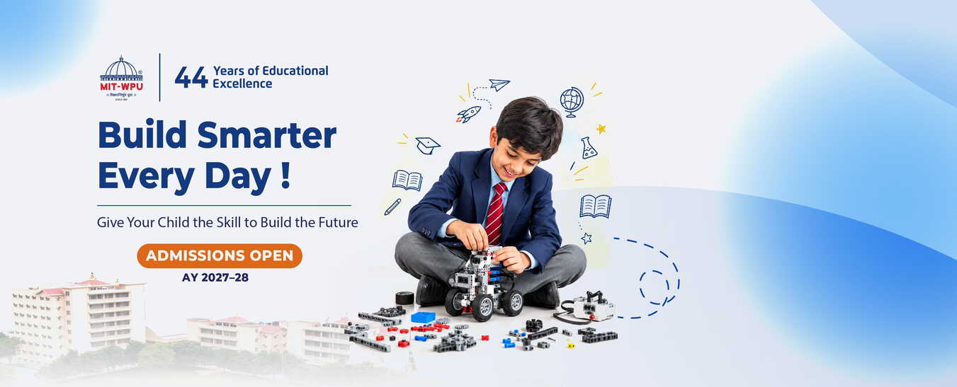 Student building a robot at MIT World Peace School Alandi