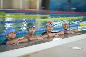 Students in the swimming pool at MIT World Peace School Alandi